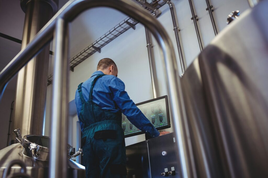 Manufacturer using computer at brewery