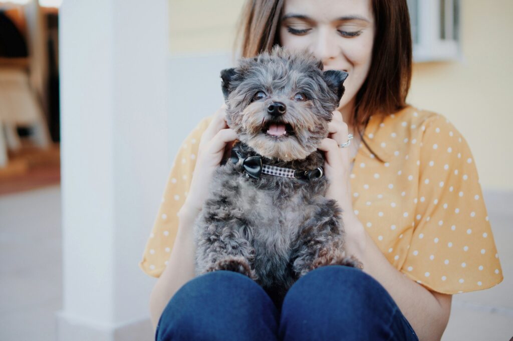 Woman with cute puppy dog people and pets